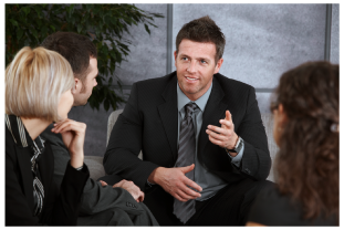 Man explaining to three others